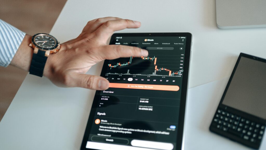 Wristwatch checking chart candlestick on tablet – Indian Stock Market Open & Close NSE BSE